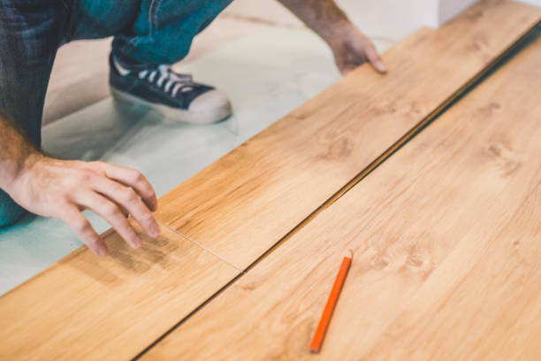 istock The builder is engaged in laying laminate in the room 1176386966