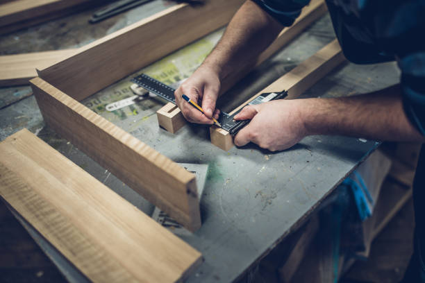 istock Carpentry workshop - the process of making a wooden table 1176387096