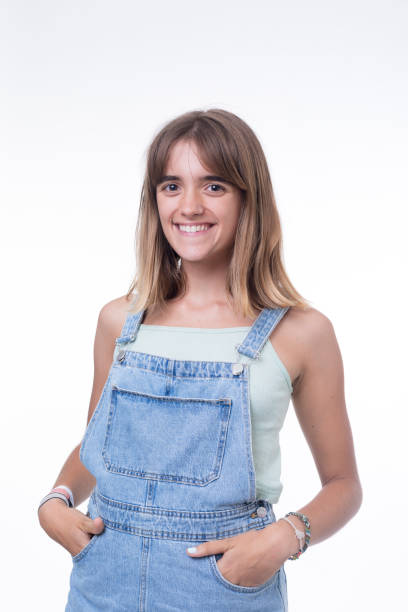 istock Casual young woman smiling against white background 1176387800