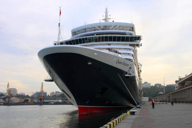 Cruise liner Queen Elizabeth Cruise liner Queen Elizabeth of Cunard Line shipping company is ready to depart on a sea voyage from the berth of passenger terminal in port of Odessa. October 06, 2012 mooring line stock pictures, royalty-free photos & images