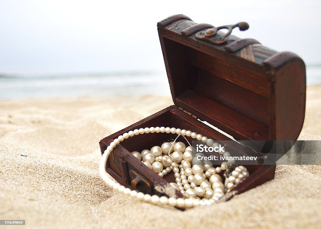 Treasure in the sand Treasure Chest Stock Photo