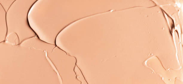istock Beige texture of makeup smear background. 1176402435