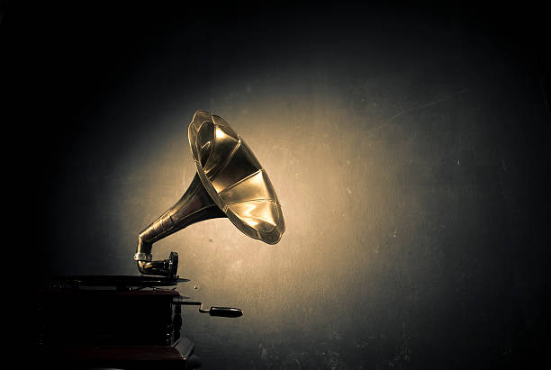 Gramophone A gramophone in front of black wall. Colors are converted as cross process. gramophone stock pictures, royalty-free photos & images