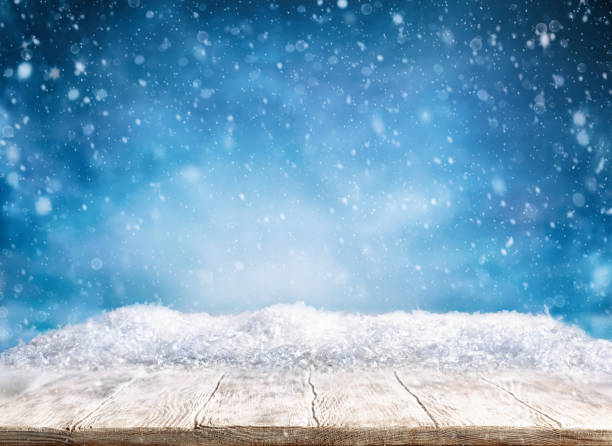 istock Beautiful winter background with wooden old desk and blurred blue sky. 1176408049