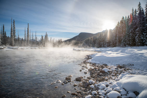 istock Foggy river and snowy landscape in Canada, Winter 1176409184