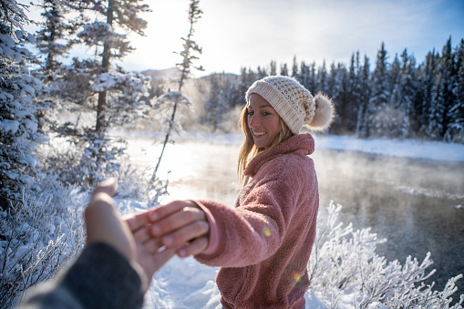 Come with me on my winter journey vacations; Couple holding hands