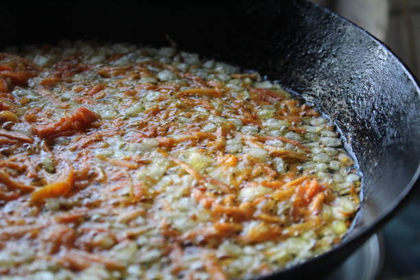 istock fried onions and carrots in a skillet 1176410674