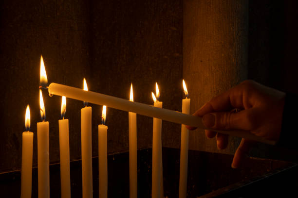 istock votive candles lit in a church 1176411637