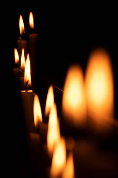 votive candles lit in a church