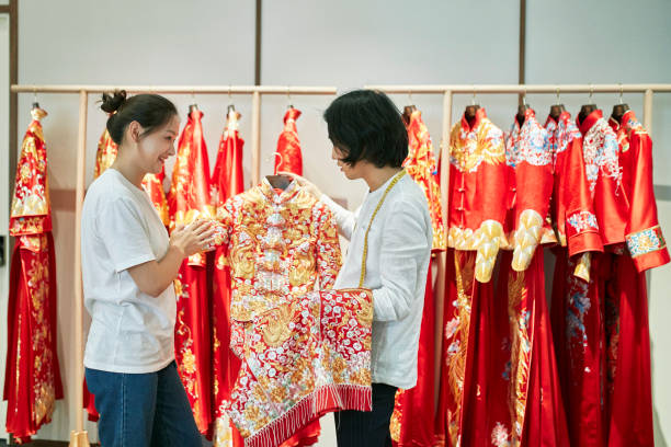 istock Young Chinese Bride-To-Be and Designer Looking at Qun Gua 1176413964