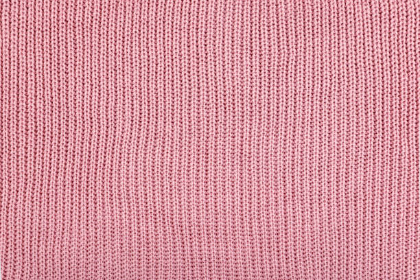 istock Pink Knitted Fabric background. Knitted woolen fabric rose Texture. Abstract wool sweater texture close up. 1176414607