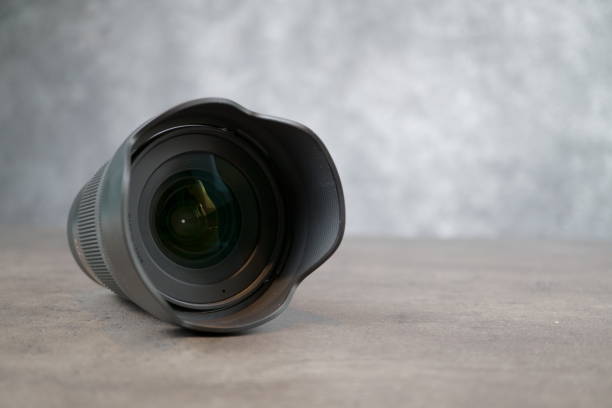 istock Tallinn / Estonia / 17.09.2019 dslr camera lense, close-up view on table with smooth background 1176419664