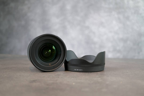 istock Tallinn / Estonia / 17.09.2019 dslr camera lense, close-up view on table with smooth background 1176419666