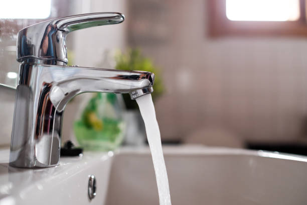 istock Open faucet washbasin with high water pressure 1176419756