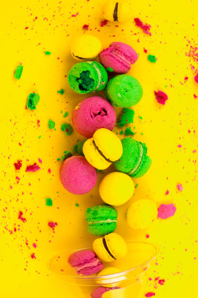 istock Colored, bright, sweet macaroons on a yellow background. Antigravity. Asymmetry. 1176422513