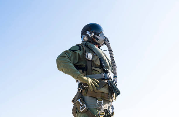 Pilot with suit and military air. Fighter pilot portrait posing