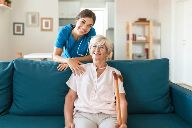 istock Elderly woman smiling with a nurse 1176424916