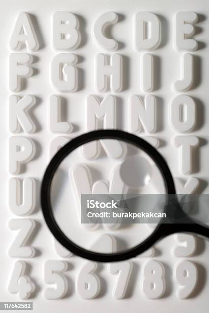 Magnifying Glass Emphasizing Letter W On White Alphabet Sheet Stock Photo - Download Image Now