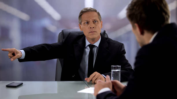 istock Angry male chief pointing exit to male candidate during job interview, fail 1176426683