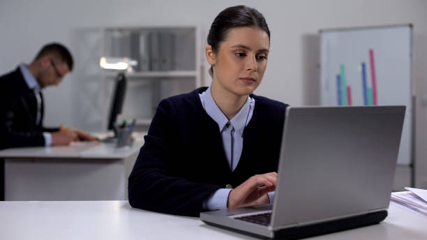 istock Tired female office worker typing on laptop, overworking concept, exhaustion 1176426759