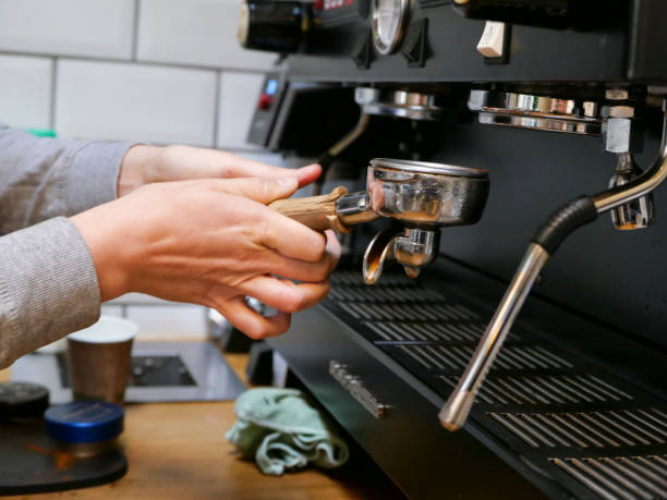 istock A barista making coffee with a large commercial coffee making machine 1176427157