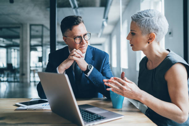 Business coworkers Business coworkers working together at office explaining stock pictures, royalty-free photos & images