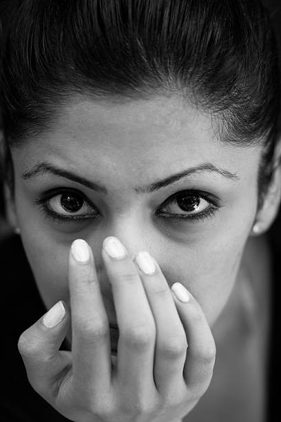 istock Young Woman Covering Her Face With Fingers 117642905