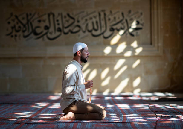 Muslim man praying in mosque