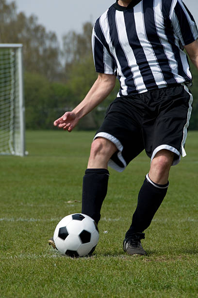 istock Football player passes the ball 117642939
