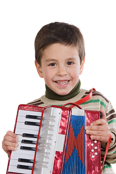 istock Adorable child playing red accordion 117643125