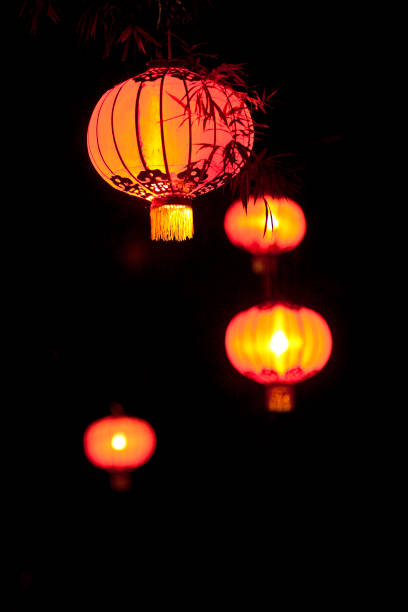istock Chinese Lanterns shine overhead in a market place 1176431411