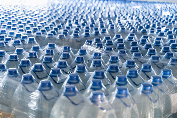 istock Many plastic bottles with drinking pure water and blue caps 1176436483