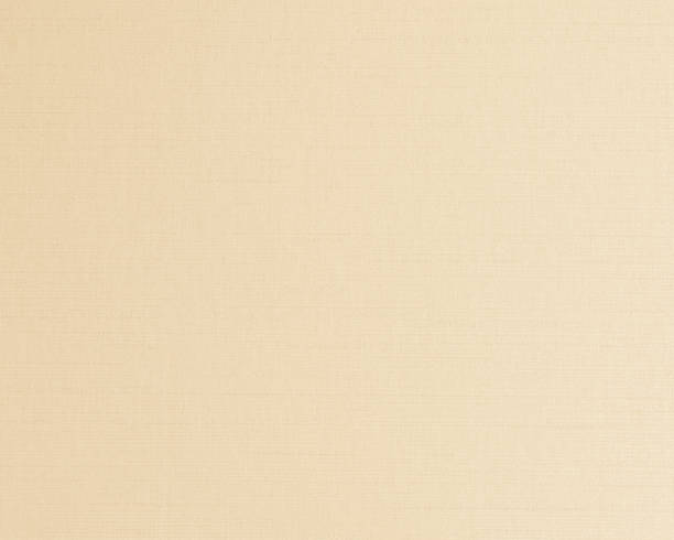 istock Cotton silk fabric wall paper texture pattern background in light pastel white yellow cream beige sepia tan brown color earth tone 1176438470