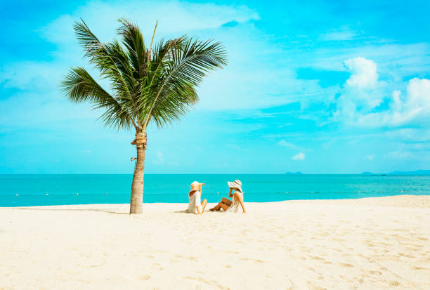 istock Cuople woman at tropical beach 1176438502