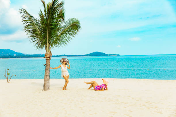 istock Cuople woman at tropical beach 1176438504