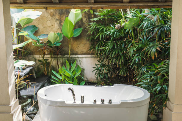 istock Outdoor white stone empty bath over green tropical nature background. 1176438653