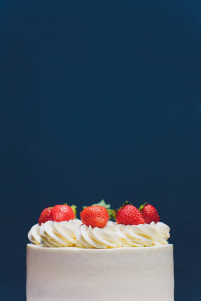 istock Cake decorated with isomalt shape and strawberries on blue background. 1176439850