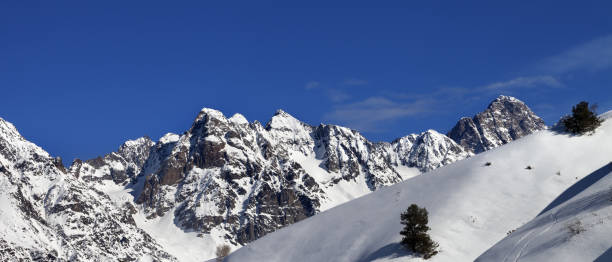 istock Off-piste slope with track from ski and snowboard on sun day 1176440015