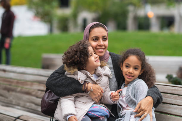 istock Muslim woman spending time with young daughters 1176440275