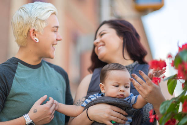 istock Happy lesbian couple with baby 1176440394