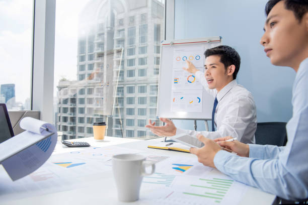istock Asian businessman presenting business plan charts 1176446049