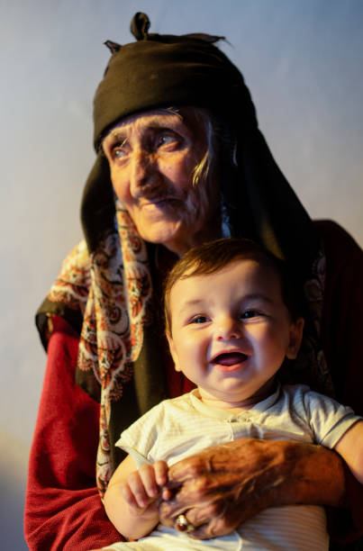 Little old woman with white hair and lasses smiling 