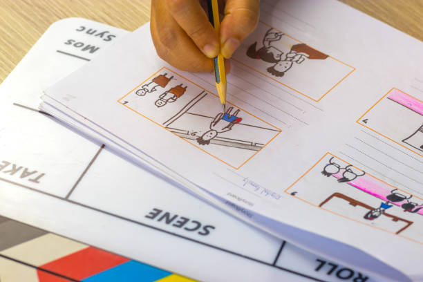 istock Storyboard drawing with pencil creative sketch cartoon. Storyboarding is process image displayed in sequence for purpose of pre-visualizing motion picture, interactive media. Concept sketching ideas. 1176452242