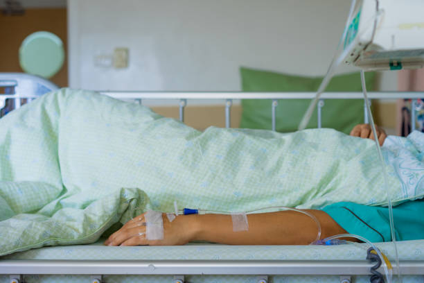 istock the intravenous fluid in a patient hand. 1176452886