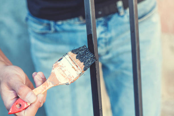 istock man hand paint brush in nature 1176453551