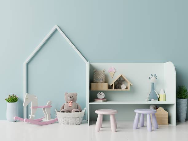 istock Mock up in children's playroom with tent and table sitting doll on empty blue wall background. 1176455810