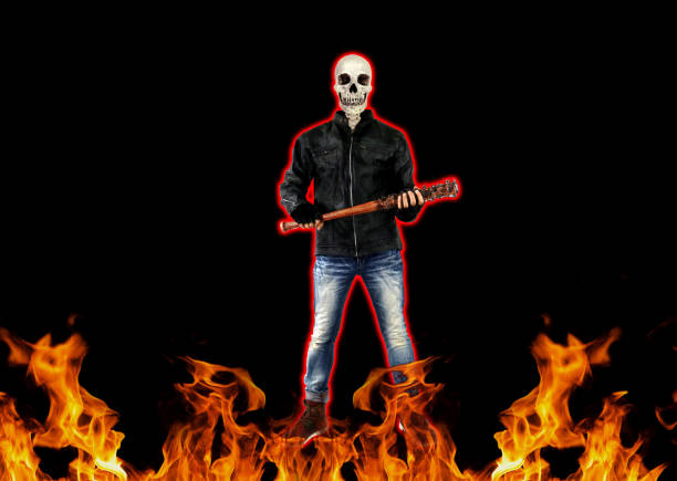 crazy skull killer zombie with barbed wire baseball bat on fire back background halloween