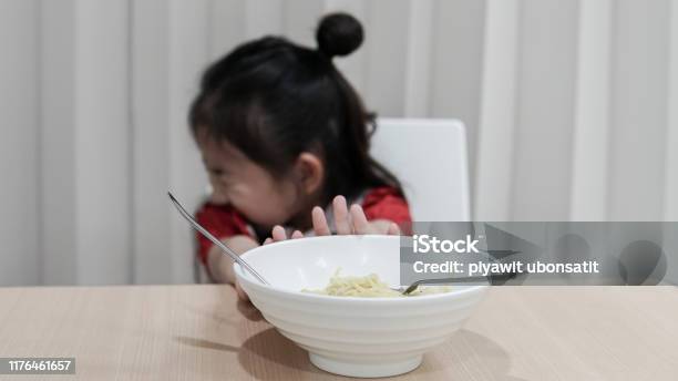 Portrait Of Asian Child Girl Refuse To Eat Food Or Food Bored Child Anorexia Stock Photo - Download Image Now