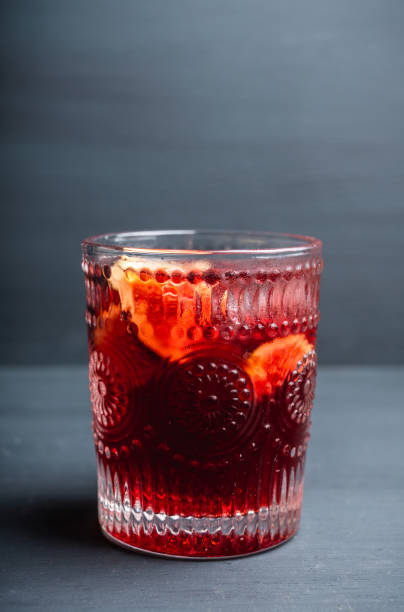 istock Old-fashioned cocktail with figs on the rustic background 1176461714
