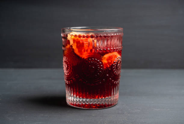 istock Old-fashioned cocktail with figs on the rustic background 1176461722